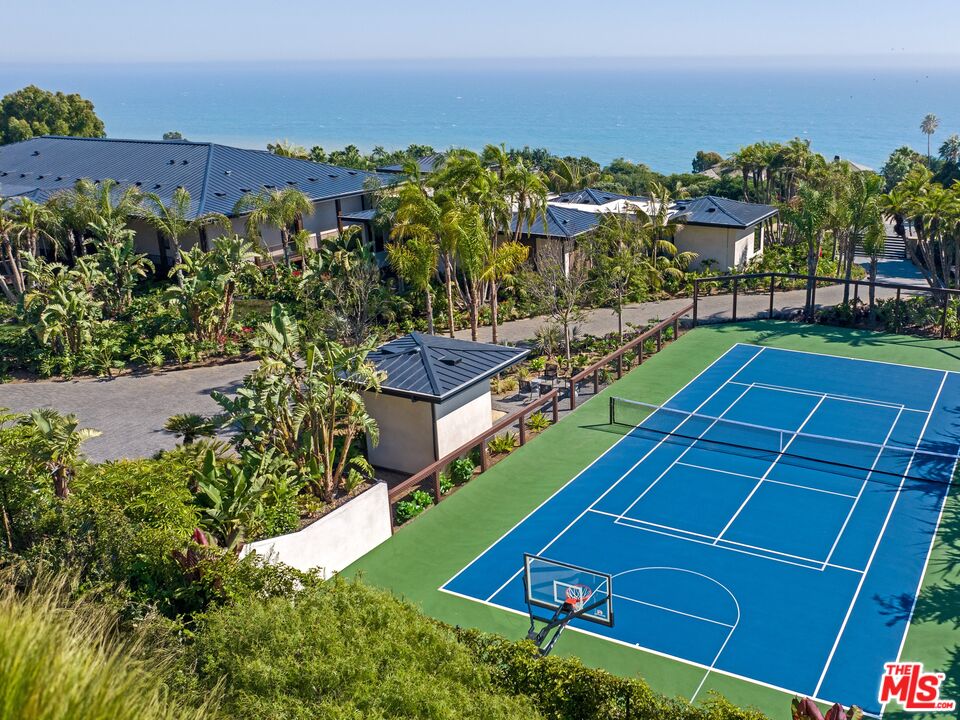 11809 Ellice Street Malibu, CA 90265 - Photo 36 of 39 a view of a tennis ground with a large trees