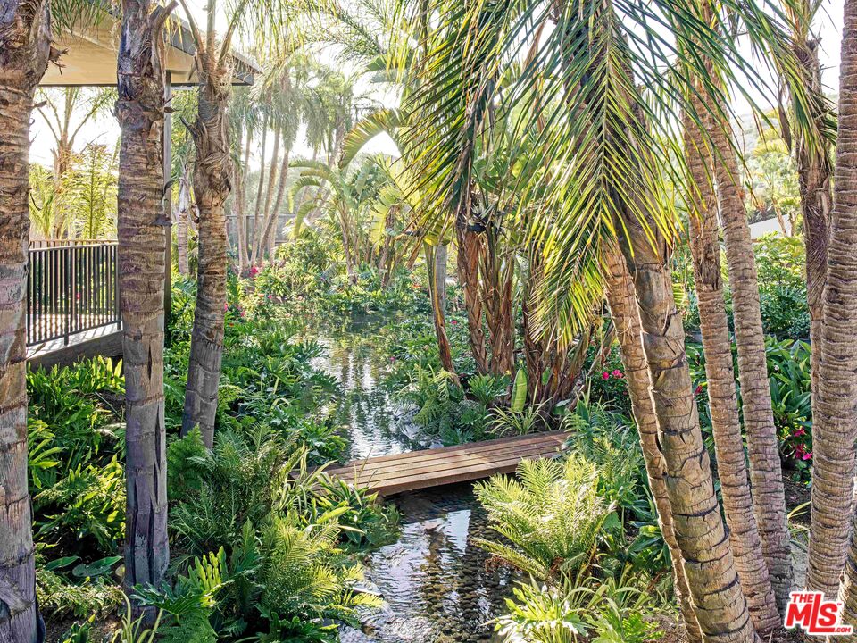 11809 Ellice Street Malibu, CA 90265 - Photo 10 of 39 a backyard of a house with a garden and plants