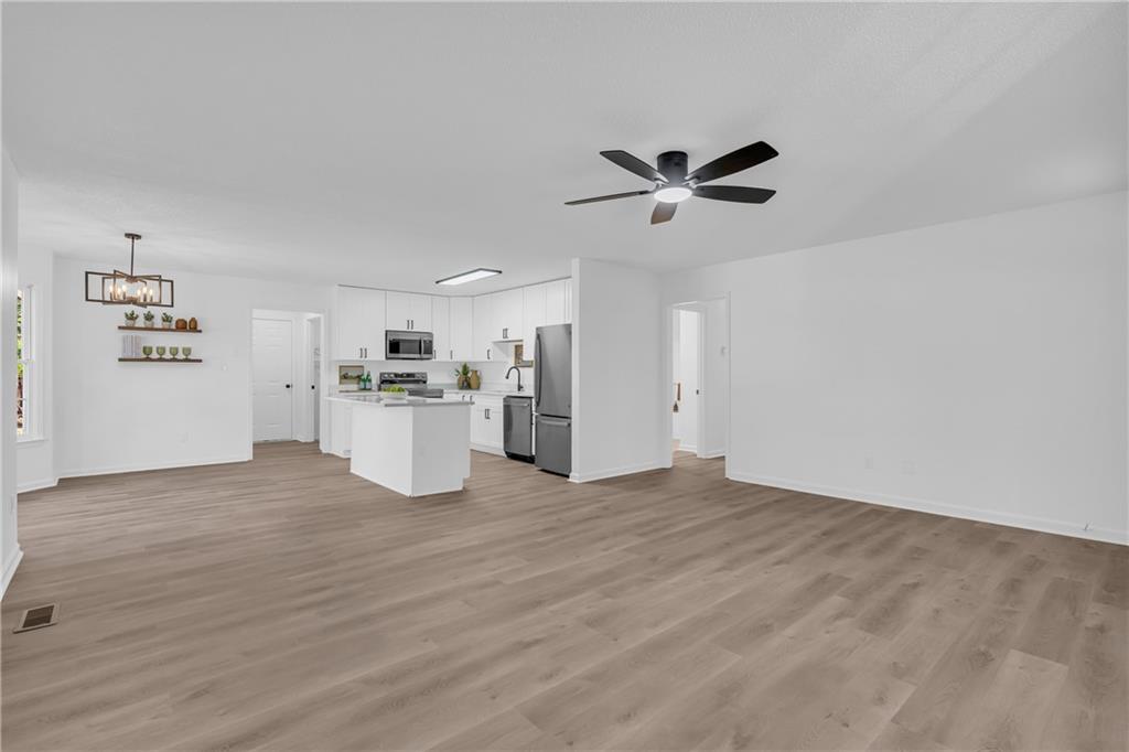 2693 Highway 101 Temple, GA 30179 - Photo 11 of 69 a view of a kitchen with a sink and a refrigerator