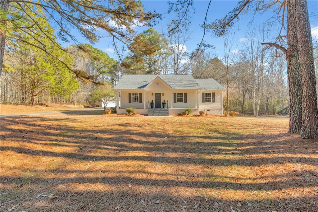 2693 Highway 101 Temple, GA 30179 - Photo 2 of 69 a front view of residential houses with yard and trees