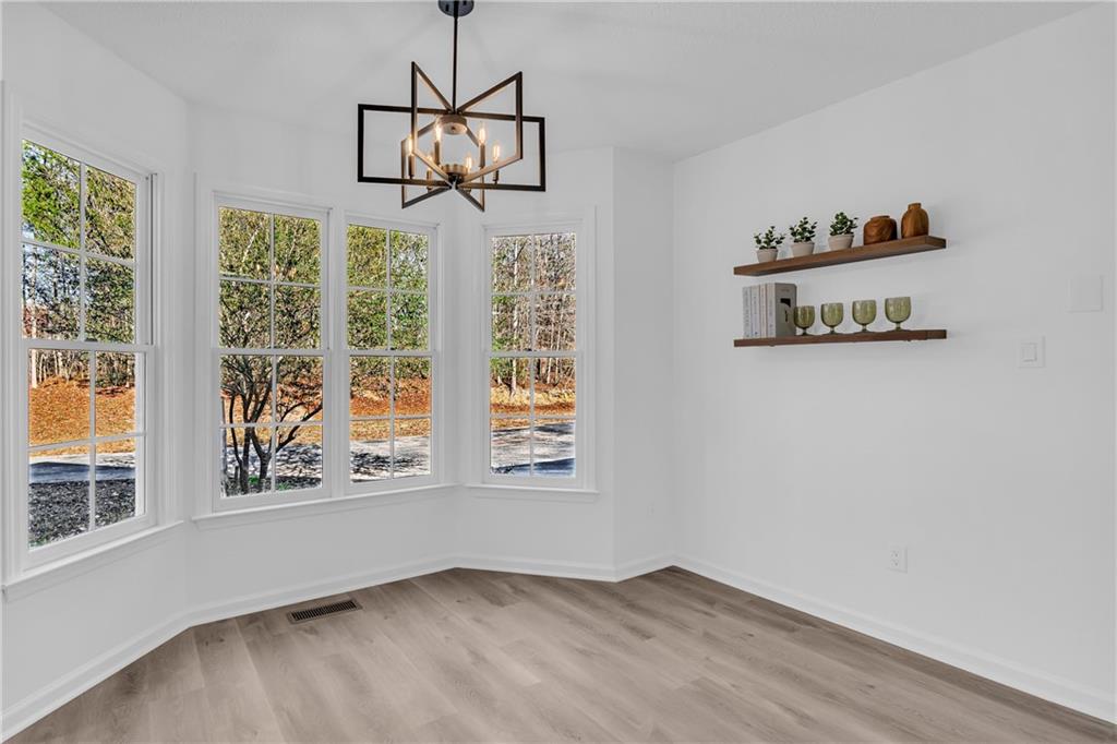 2693 Highway 101 Temple, GA 30179 - Photo 21 of 69 an empty room with windows and fan