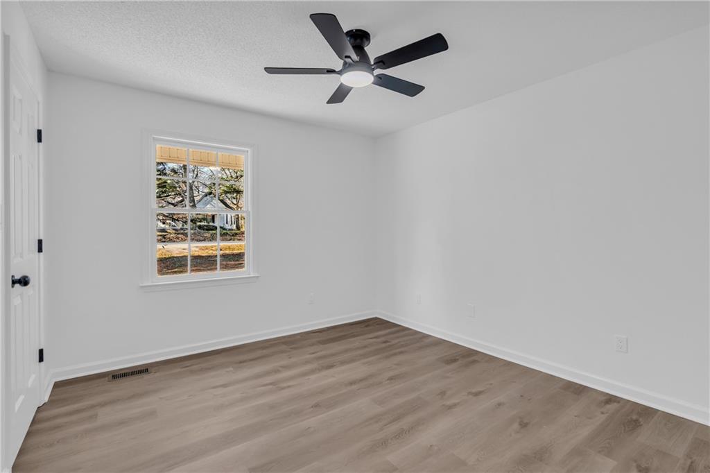 2693 Highway 101 Temple, GA 30179 - Photo 32 of 69 an empty room with a window and a fan