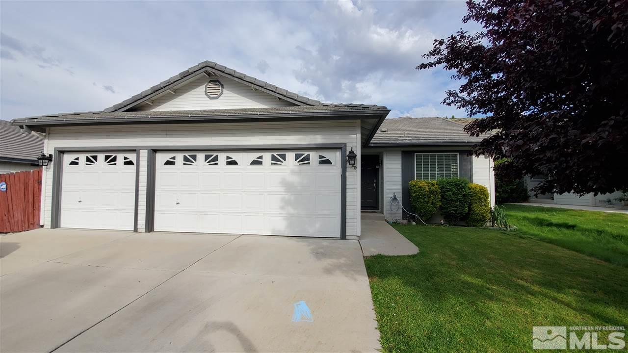 4580 Goodwin Road Sparks, NV 89436 - Photo 1 of 12 a front view of a house with garden