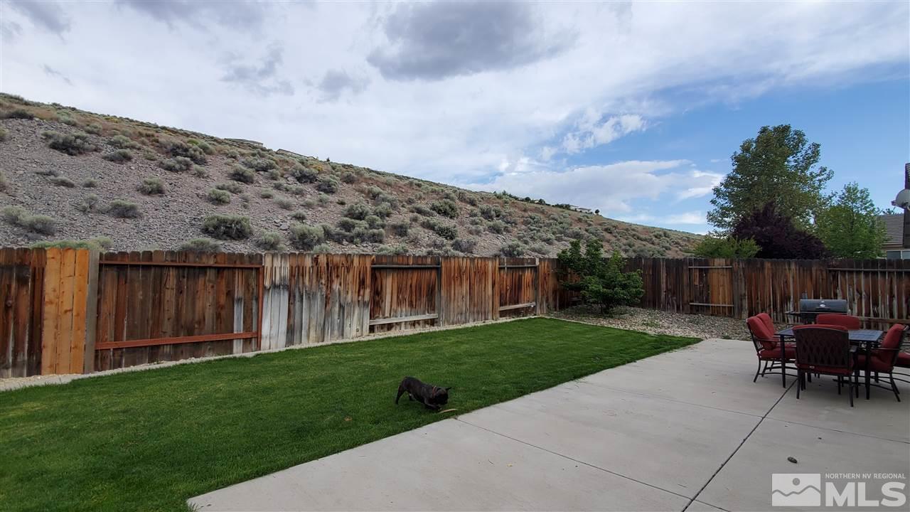 4580 Goodwin Road Sparks, NV 89436 - Photo 12 of 12 a backyard of a house with table and chairs