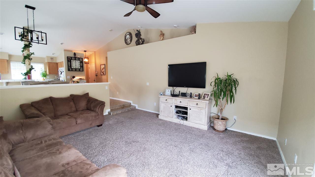 4580 Goodwin Road Sparks, NV 89436 - Photo 4 of 12 a living room with furniture and a flat screen tv