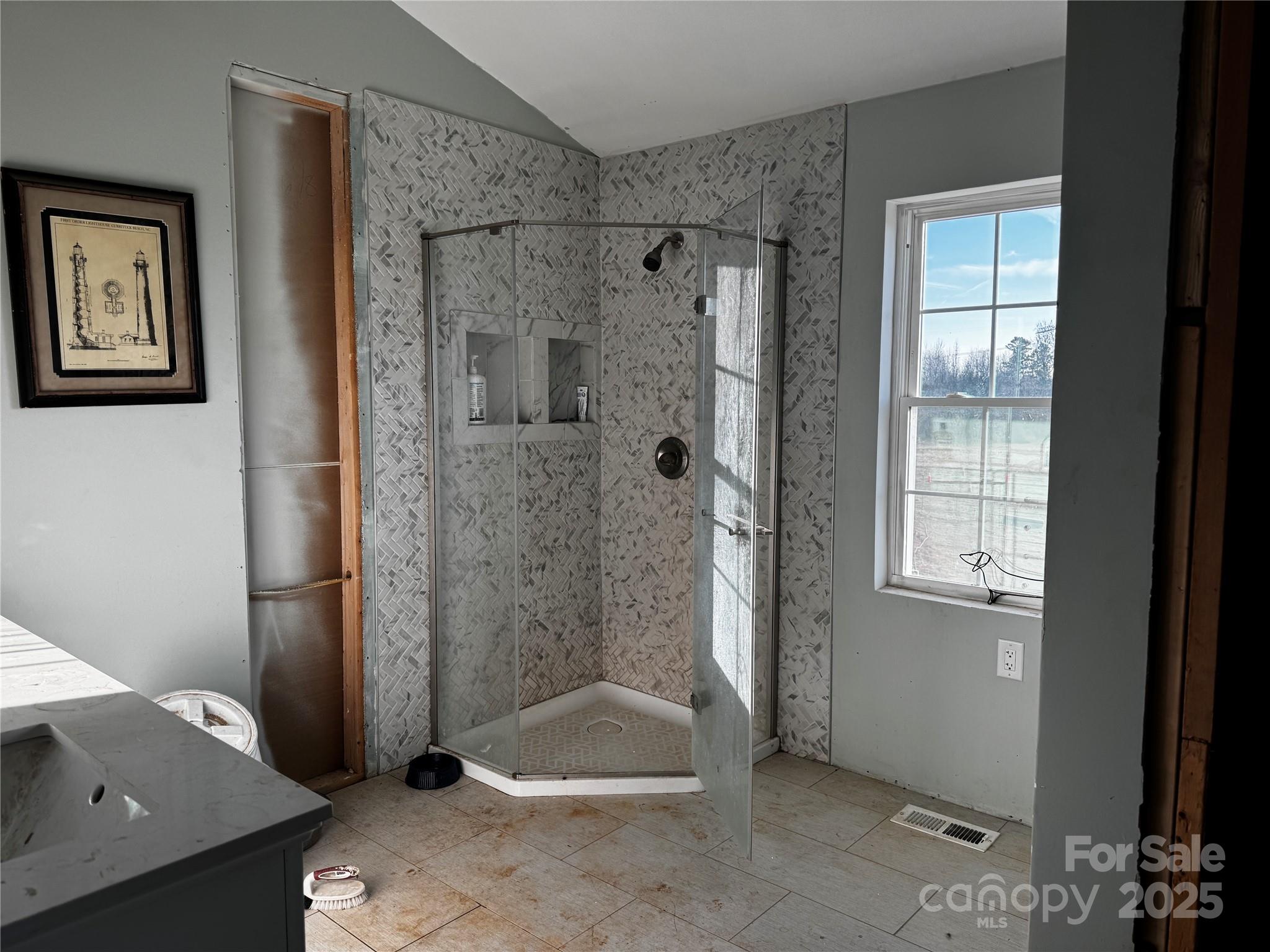 134 Charcoal Road Cherryville, NC 28021 - Photo 30 of 35 a bathroom with a bathtub and a shower