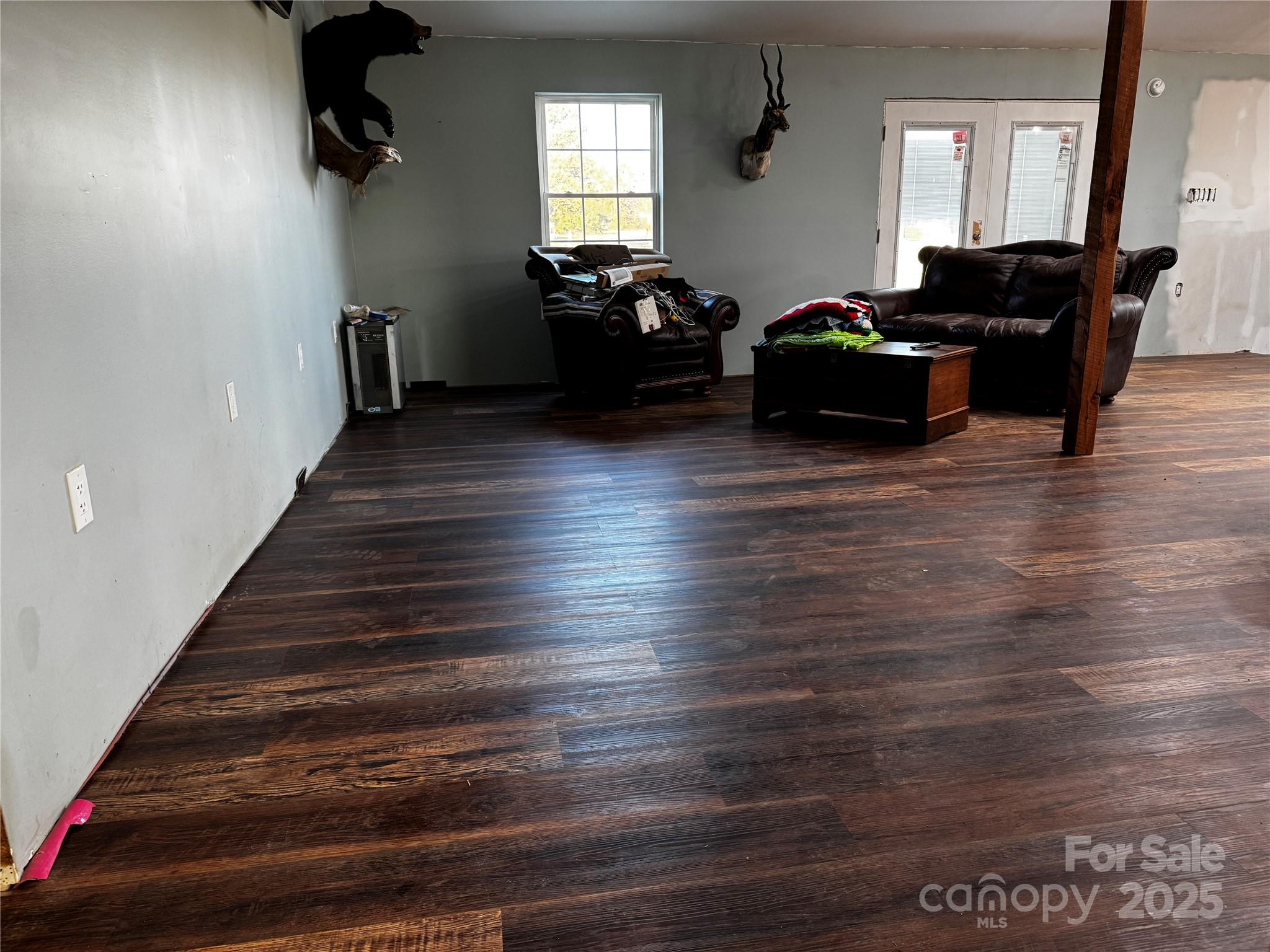 134 Charcoal Road Cherryville, NC 28021 - Photo 31 of 35 a living room with furniture and a wooden floor