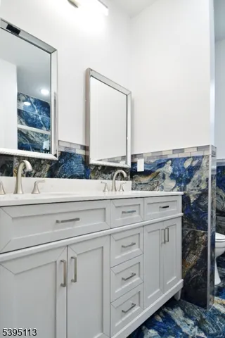 a bathroom with a bathtub and shower