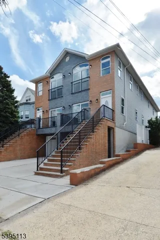 a view of a house with wooden stairs