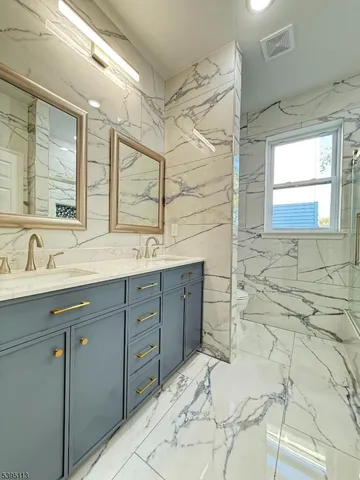 a bathroom with a bathtub and a shower