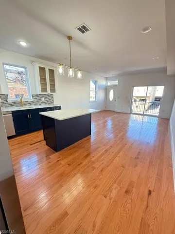 a stove top oven sitting inside of a kitchen