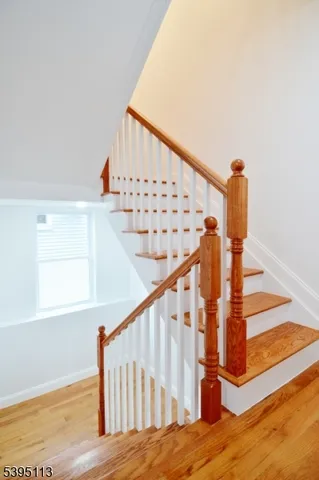a bathroom with shower sink and cabinets
