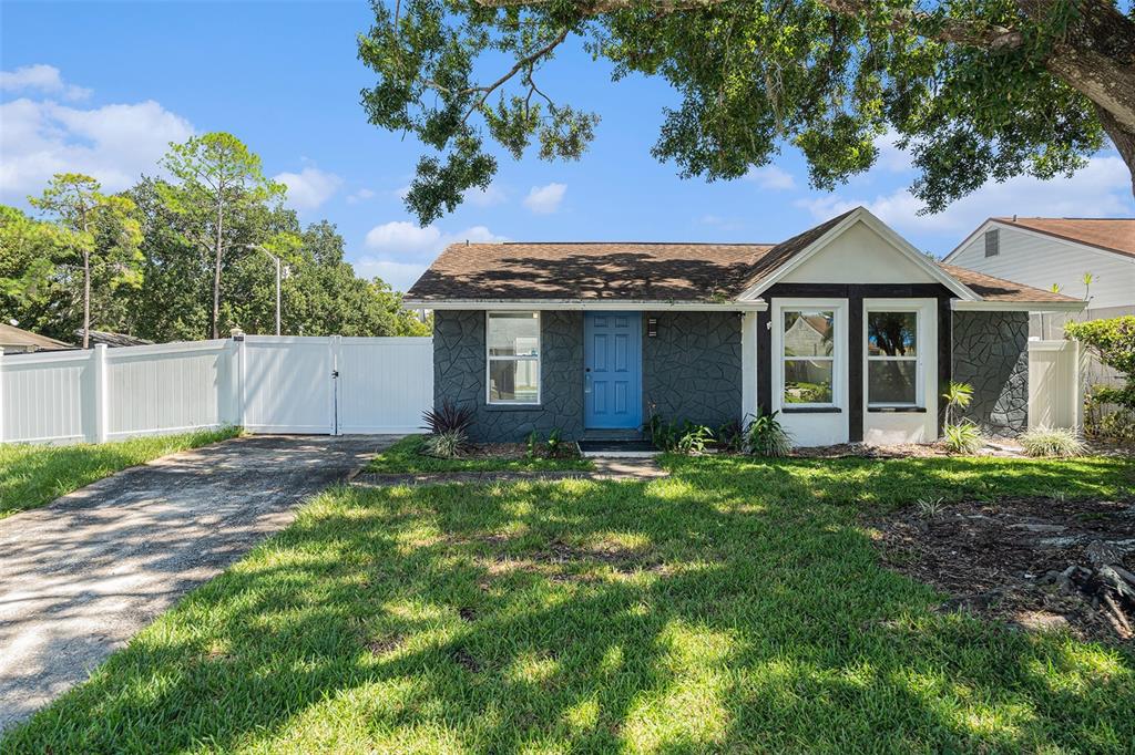 16147 Sagebrush Road Tampa, FL 33618 - Photo 1 of 18 a front view of a house with a yard