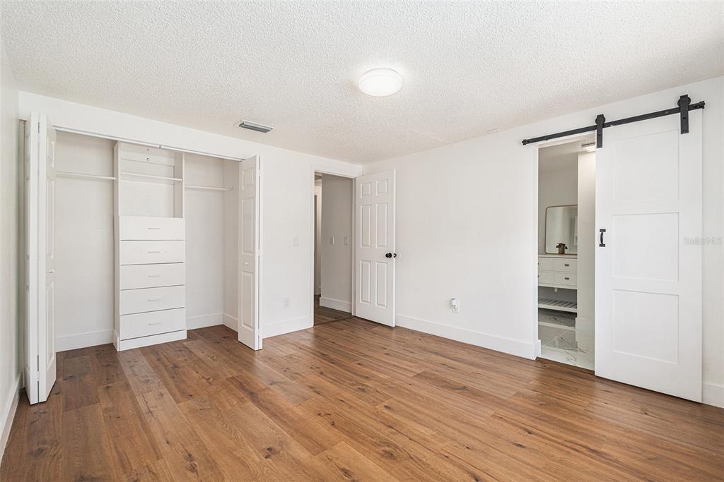 16147 Sagebrush Road Tampa, FL 33618 - Photo 15 of 18 an empty room with wooden floor