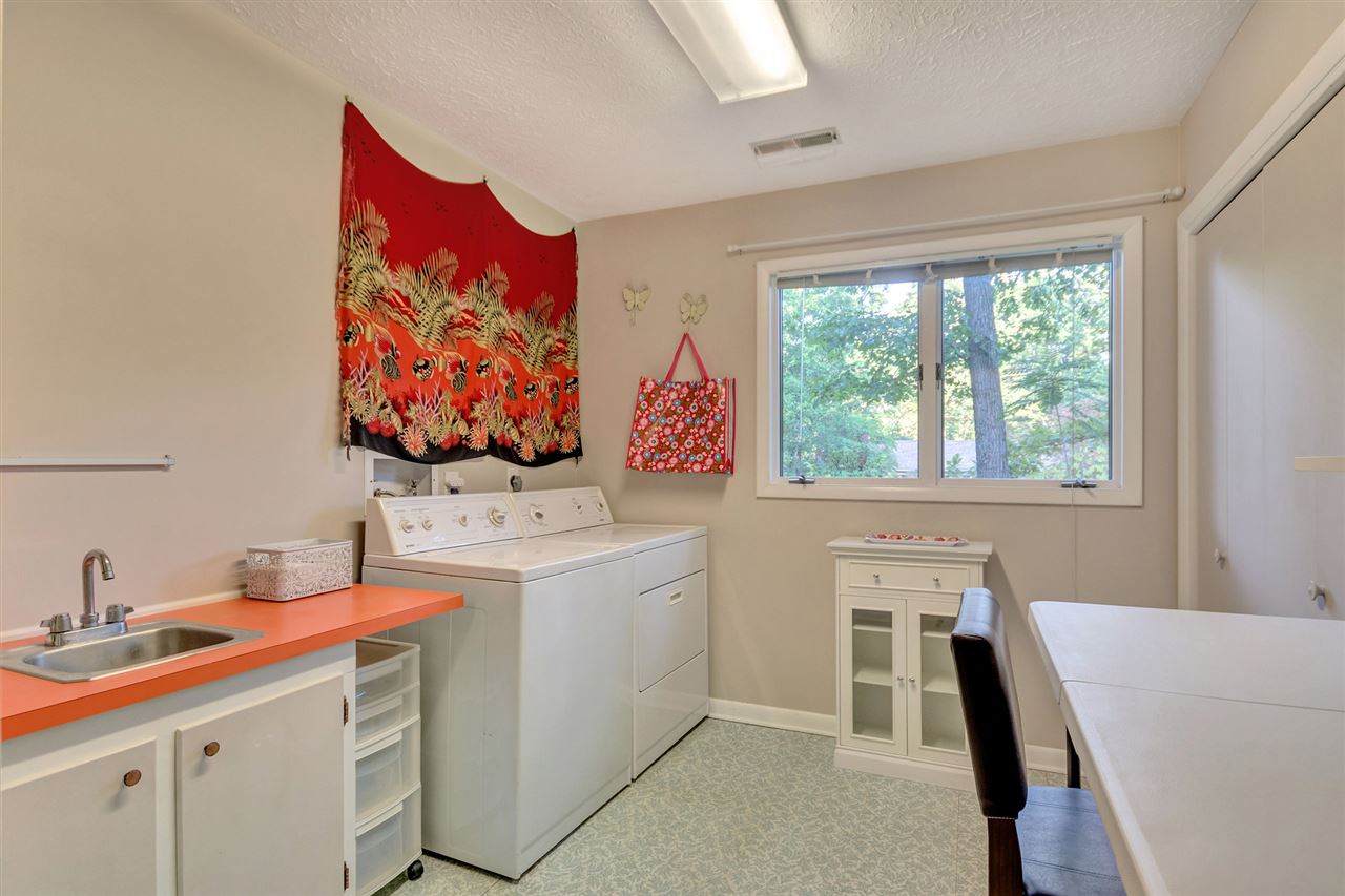 1731 Old Forge Road Charlottesville, VA 22901 - Photo 18 of 27 a view of a kitchen with a sink and a refrigerator