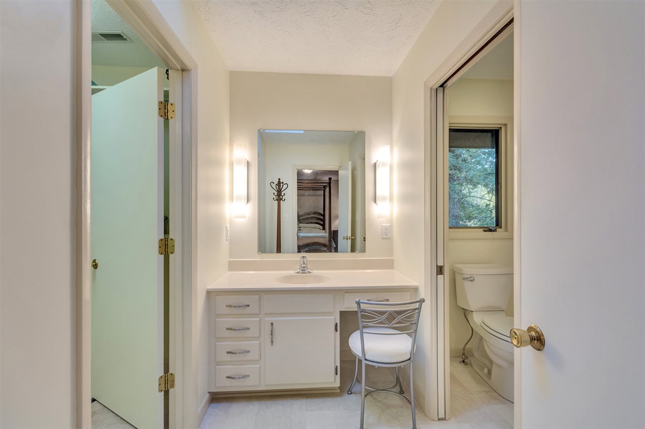 1731 Old Forge Road Charlottesville, VA 22901 - Photo 21 of 27 a bathroom with a sink vanity and mirror