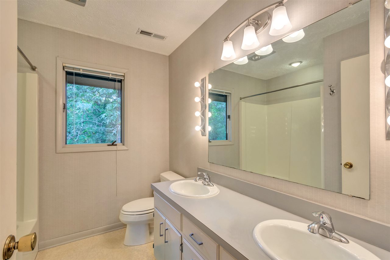 1731 Old Forge Road Charlottesville, VA 22901 - Photo 25 of 27 a bathroom with a toilet a sink and mirror