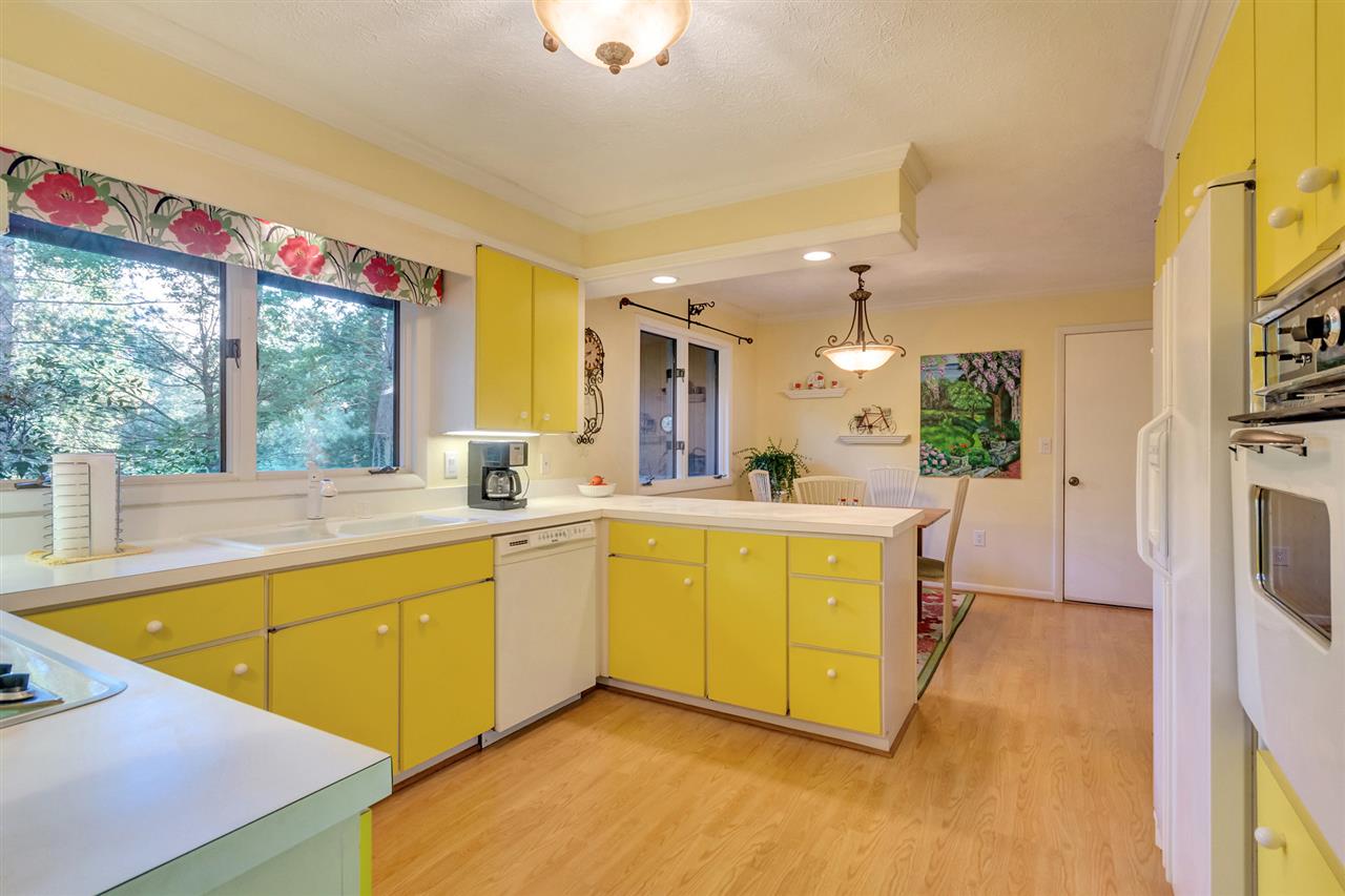 1731 Old Forge Road Charlottesville, VA 22901 - Photo 6 of 27 a large kitchen with a lot of counter space and a wooden floor