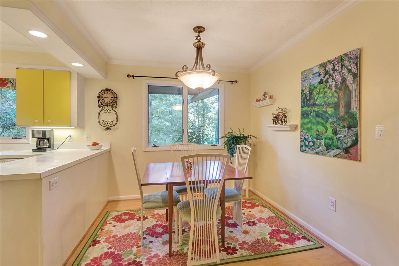 1731 Old Forge Road Charlottesville, VA 22901 - Photo 7 of 27 a view of a dining room with furniture window and wooden floor