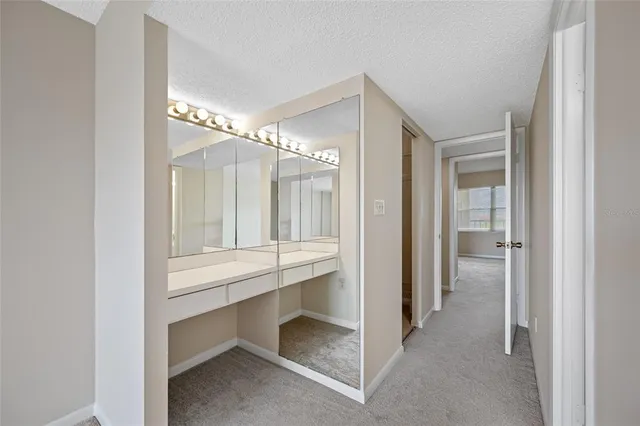 a bathroom with a sink double vanity and a toilet