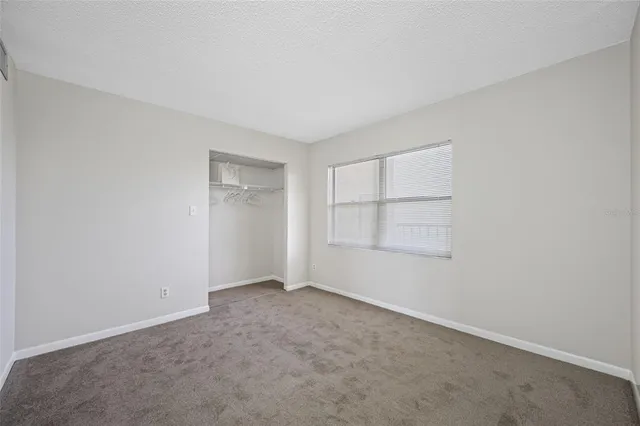 a bathroom with a toilet a sink and a mirror