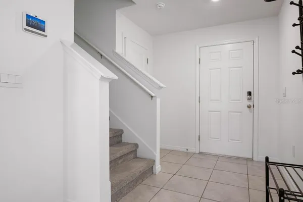 a view of an entryway with hallway