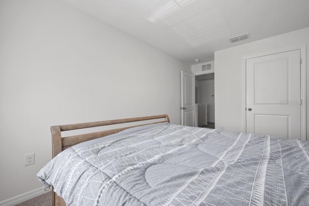 2986 Great Abaco Way Bradenton, FL 34208 - Photo 17 of 27 a bedroom with a bed and a window