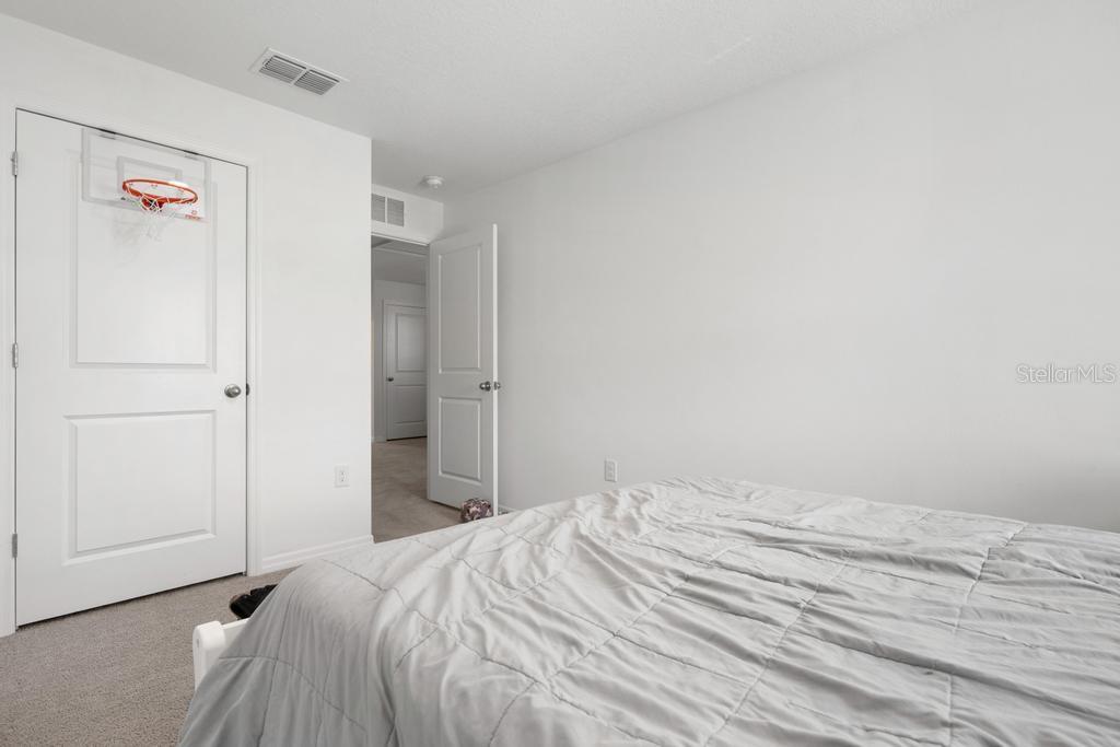 2986 Great Abaco Way Bradenton, FL 34208 - Photo 19 of 27 a bedroom with a bed and a shower