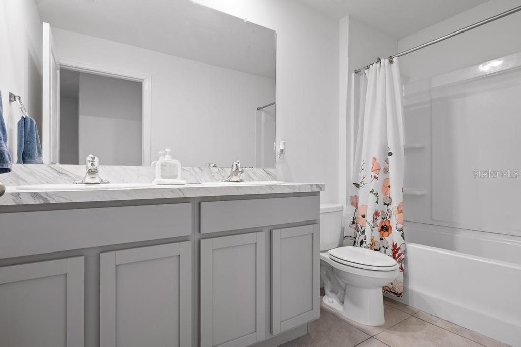 2986 Great Abaco Way Bradenton, FL 34208 - Photo 21 of 27 a bathroom with a sink toilet and shower