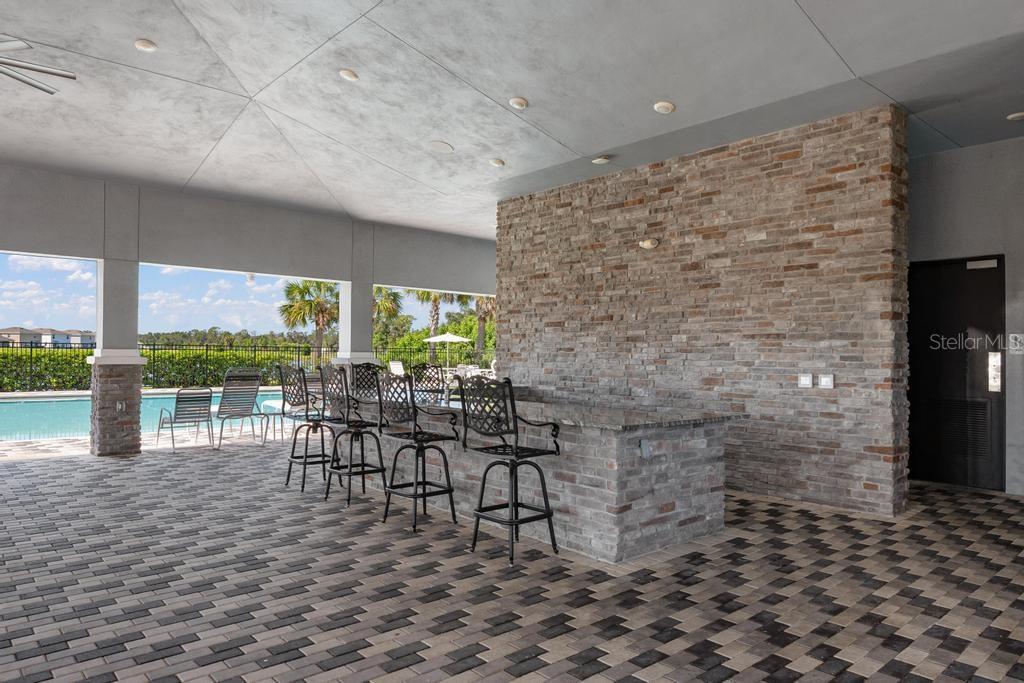 2986 Great Abaco Way Bradenton, FL 34208 - Photo 27 of 27 a dining room with furniture and a floor to ceiling window