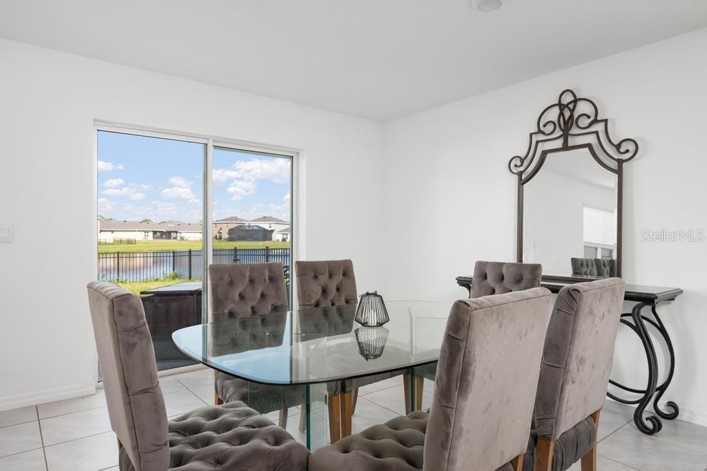 2986 Great Abaco Way Bradenton, FL 34208 - Photo 6 of 27 a view of a dining room with furniture window and outside view