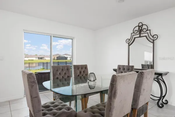 a view of a dining room with furniture window and outside view
