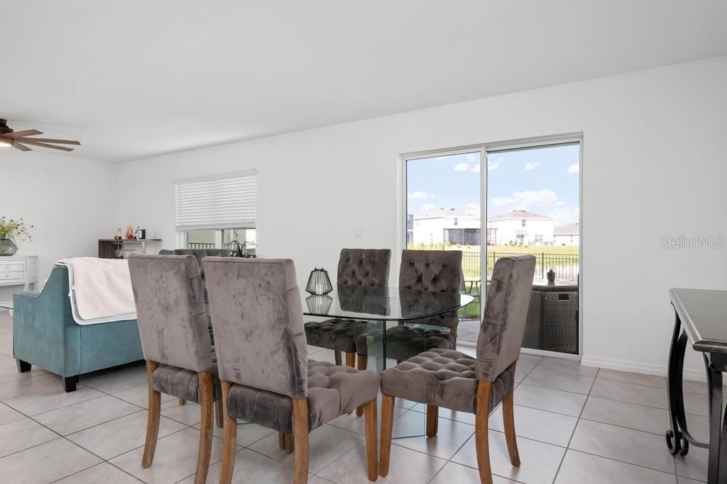 2986 Great Abaco Way Bradenton, FL 34208 - Photo 8 of 27 a dining room with furniture and window