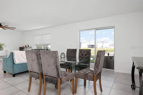a dining room with furniture and window