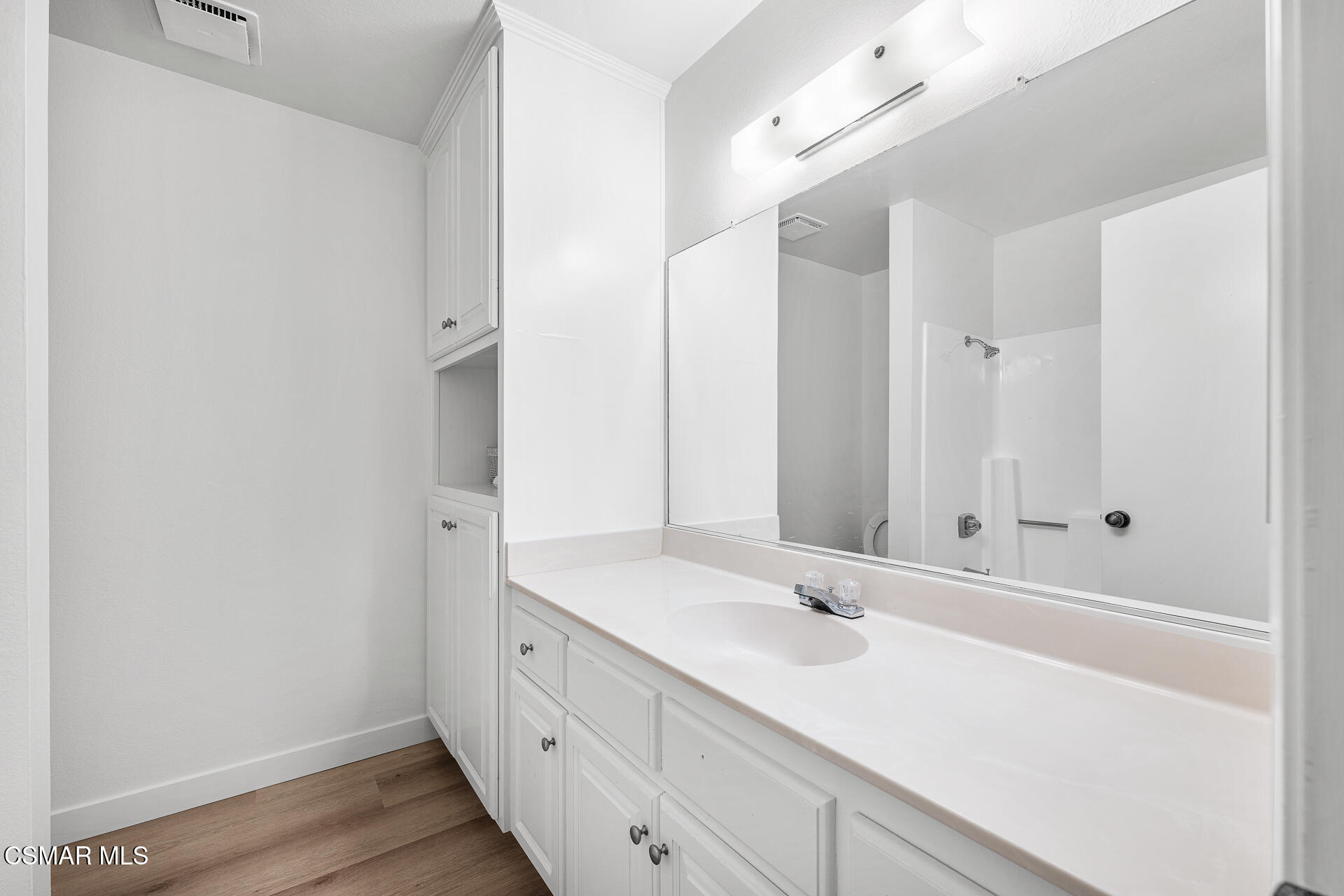 1748 Sinaloa Road, Unit 158 Simi Valley, CA 93065 - Photo 15 of 21 a bathroom with a sink and a mirror