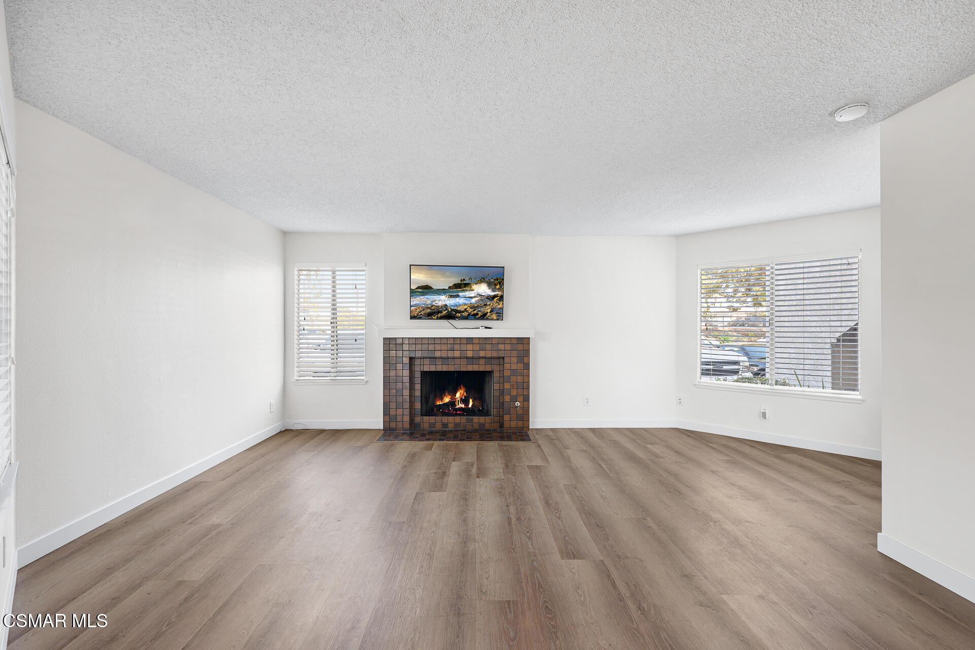 1748 Sinaloa Road, Unit 158 Simi Valley, CA 93065 - Photo 4 of 21 a view of an empty room with a window and fireplace