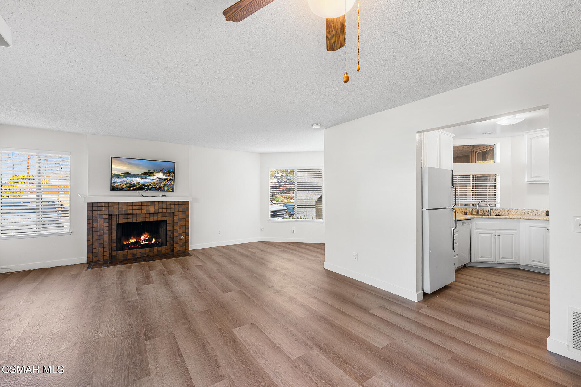 1748 Sinaloa Road, Unit 158 Simi Valley, CA 93065 - Photo 7 of 21 a view of an empty room with a window and fireplace
