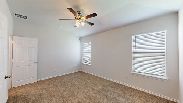a bathroom with a shower sink and mirror