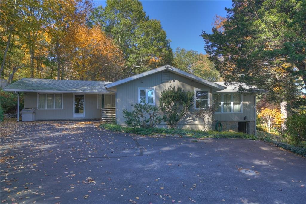 a view of a house with yard and tree s