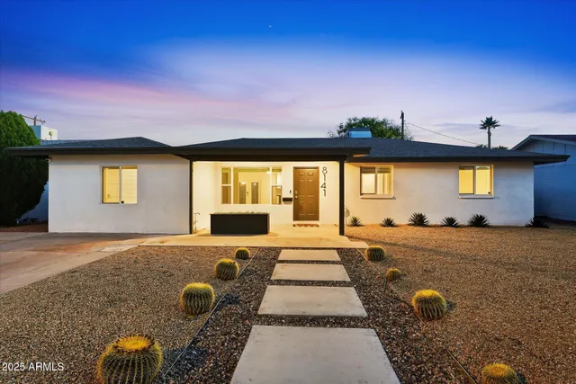 a front view of a house with yard