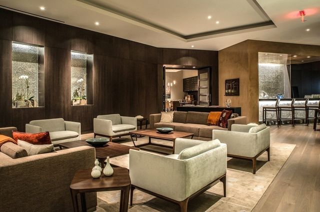 a living room with furniture and a mirror