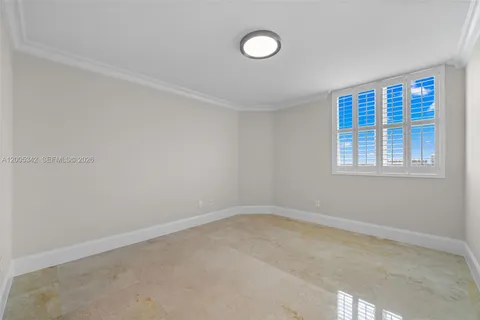 a view of an empty room with a glass door
