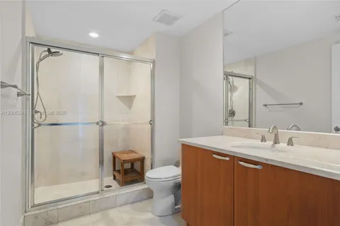 a view of bathroom with a toilet sink and a mirror