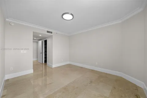a view of walk in closet with clothes