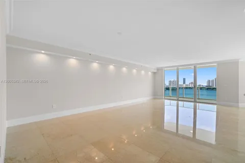 a living room with furniture and a mirror