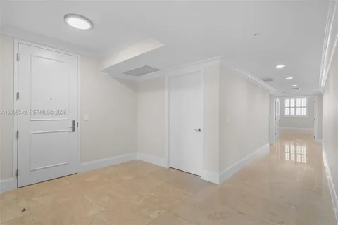 a kitchen with stainless steel appliances kitchen island granite countertop a refrigerator and a stove top oven