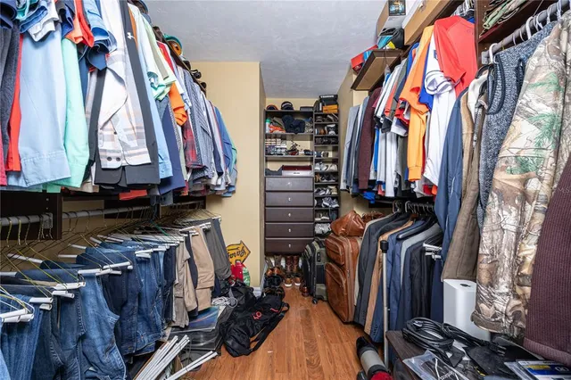 a bedroom with a bed dresser and a window