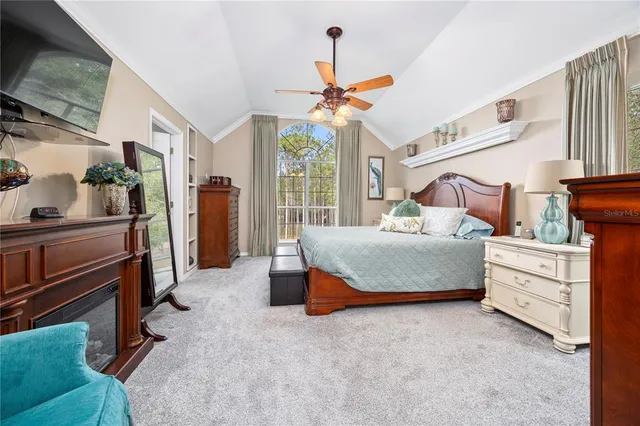 a bathroom with a granite countertop sink and a bathtub