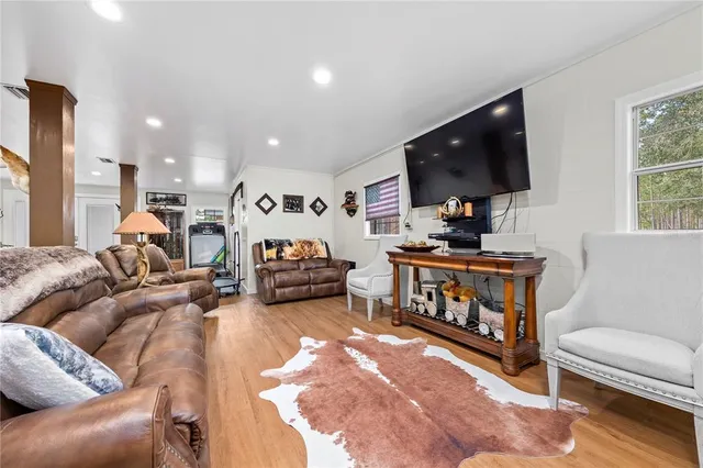 an aerial view of a house with swimming pool and mountains