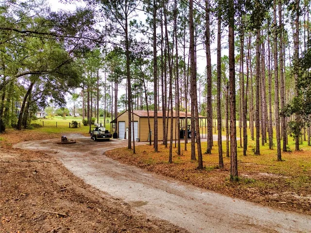 a outdoor living space with furniture and a floor to ceiling window